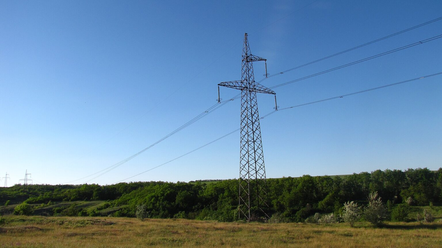 Alaska’s Beluga-Healy line: $418M, 223 miles, $150M DPA High voltage transmission tower of an overhead power line
