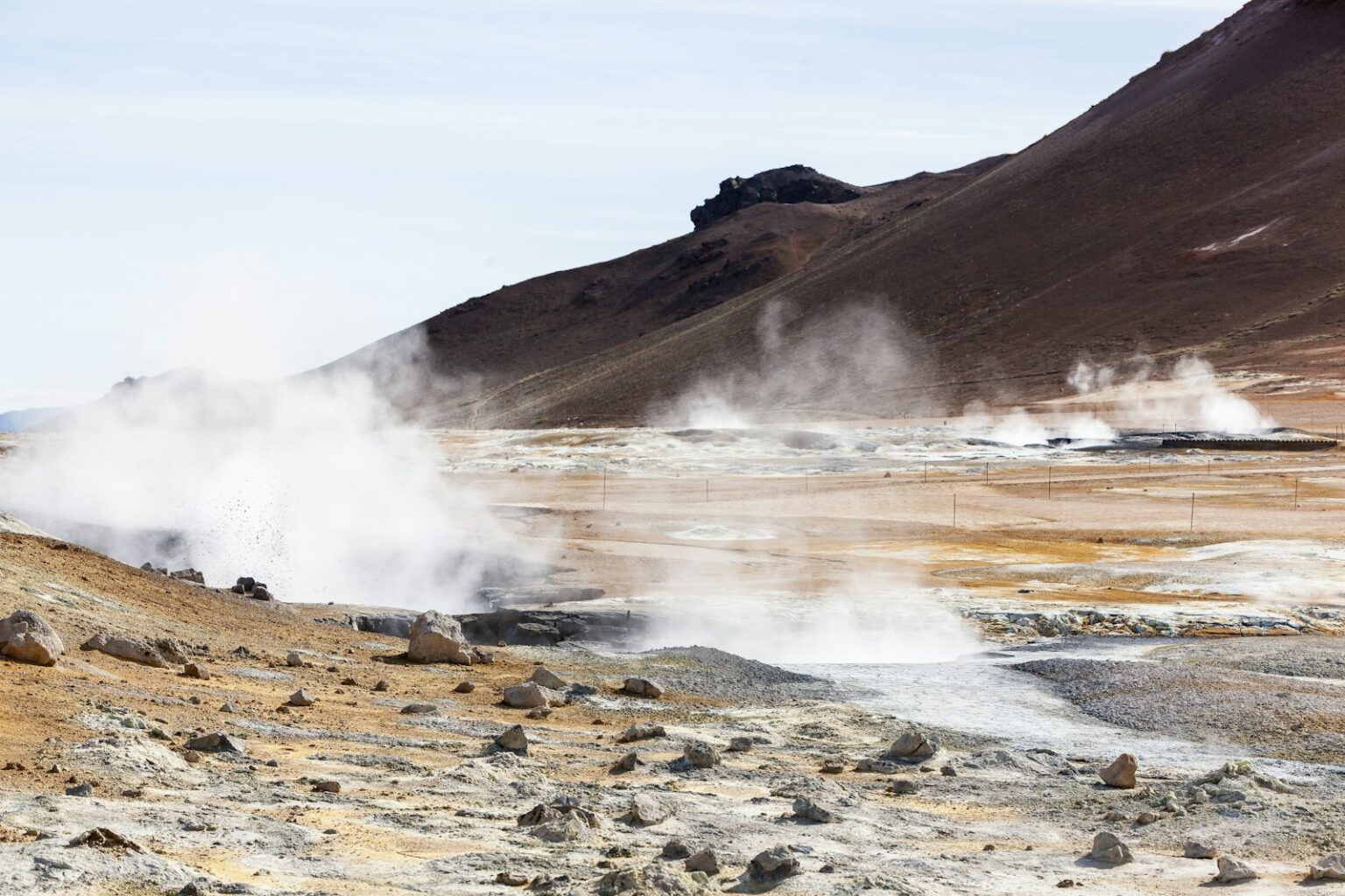 Steam rising from the ground in a volcanic landscape